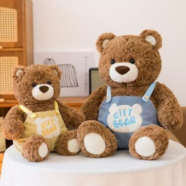 Cute teddy bear in strap overalls for birthday gifting