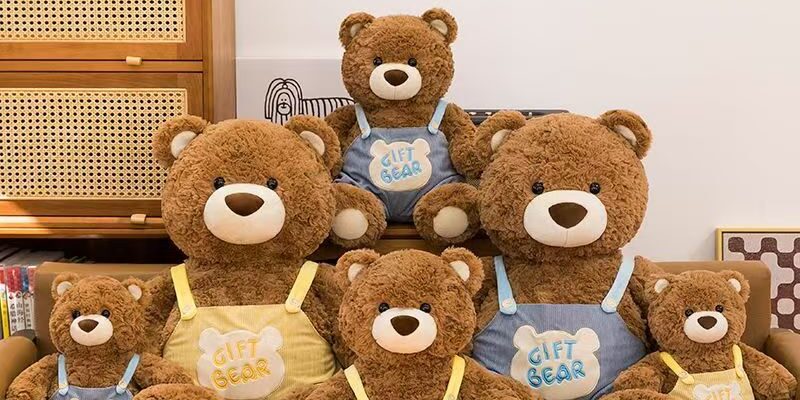 Cute teddy bear in strap overalls for birthday gifting