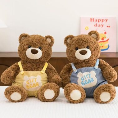 Cute teddy bear in strap overalls for birthday gifting
