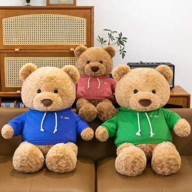 Cute teddy bear plush wearing a soft hoodie outfit