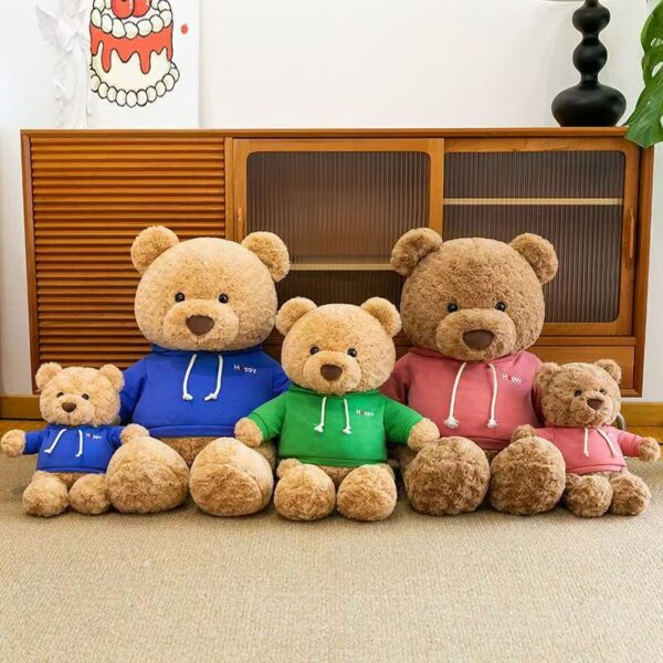 Cute teddy bear plush wearing a soft hoodie outfit