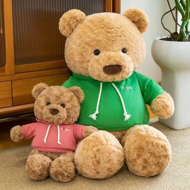 Cute teddy bear plush wearing a soft hoodie outfit