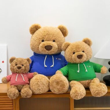 Cute teddy bear plush wearing a soft hoodie outfit
