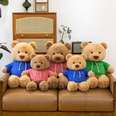 Cute teddy bear plush wearing a soft hoodie outfit