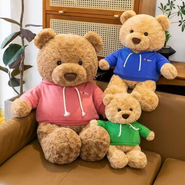 Cute teddy bear plush wearing a soft hoodie outfit