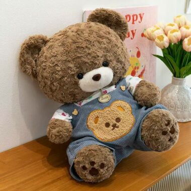 Cute teddy bear plush wearing soft overalls outfit design