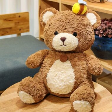 Cute kids birthday teddy bear plush toy in soft colors