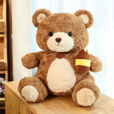 Cute kids birthday teddy bear plush toy in soft colors