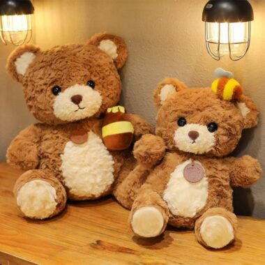 Cute kids birthday teddy bear plush toy in soft colors