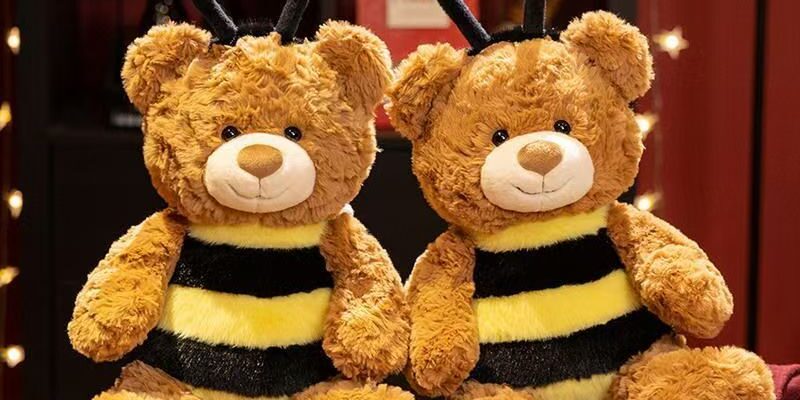 Cute kids birthday teddy bear plush toy in soft colors