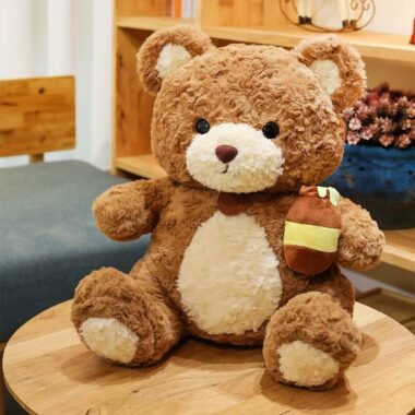Cute kids birthday teddy bear plush toy in soft colors
