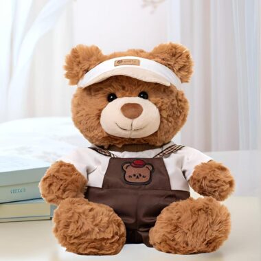 Soft cute teddy bear plush wearing strap-style outfit