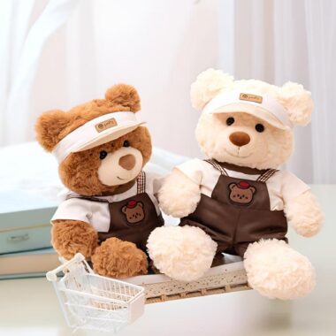 Soft cute teddy bear plush wearing strap-style outfit