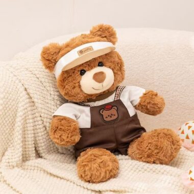 Soft cute teddy bear plush wearing strap-style outfit
