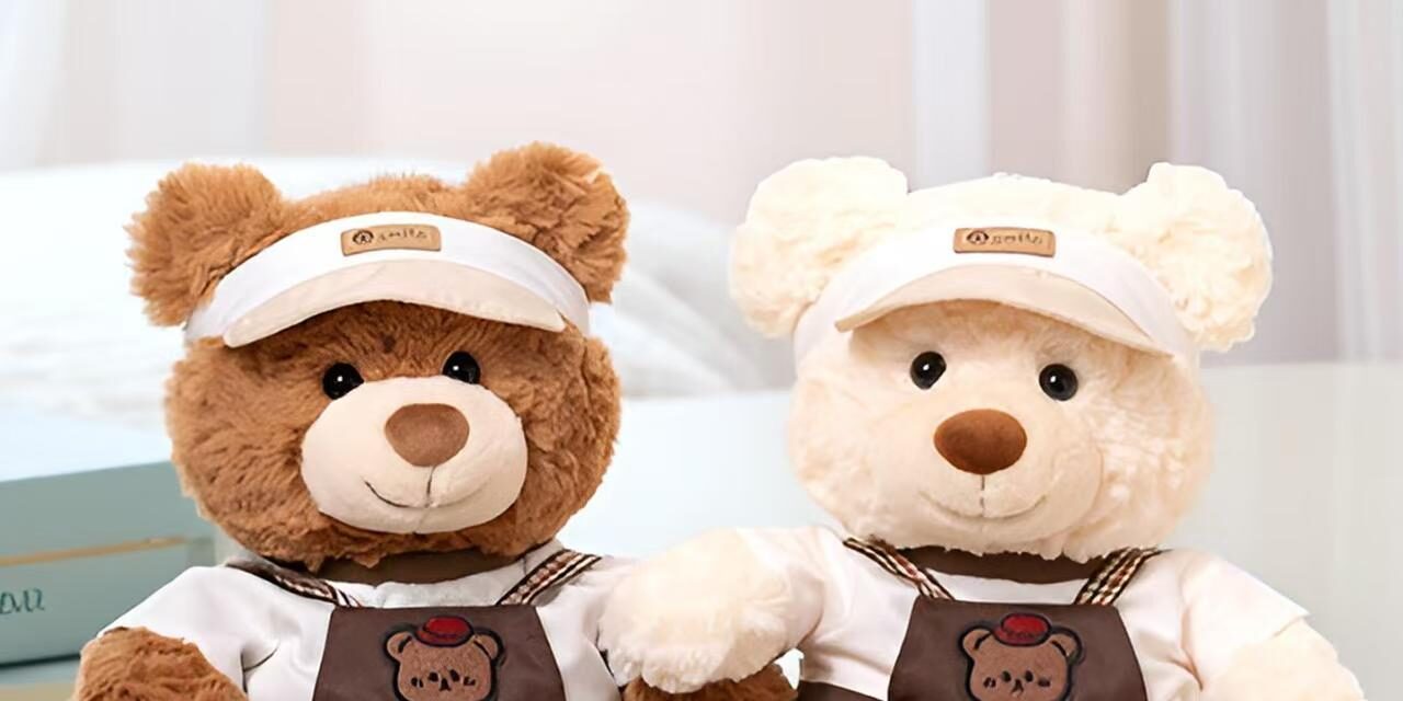 Soft cute teddy bear plush wearing strap-style outfit