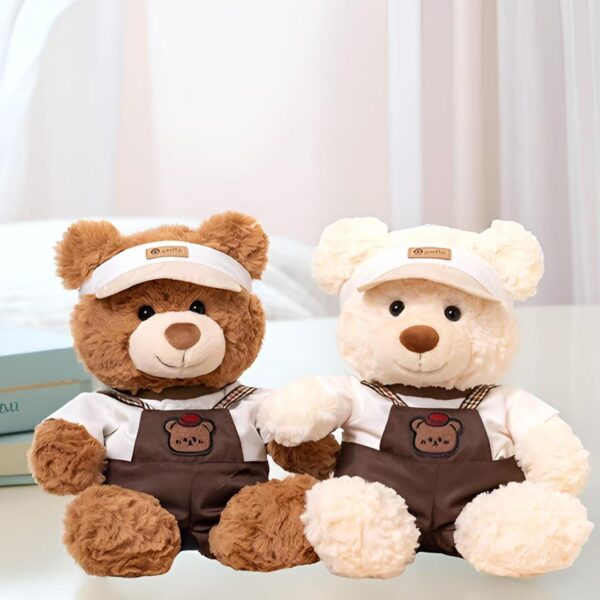 Soft cute teddy bear plush wearing strap-style outfit