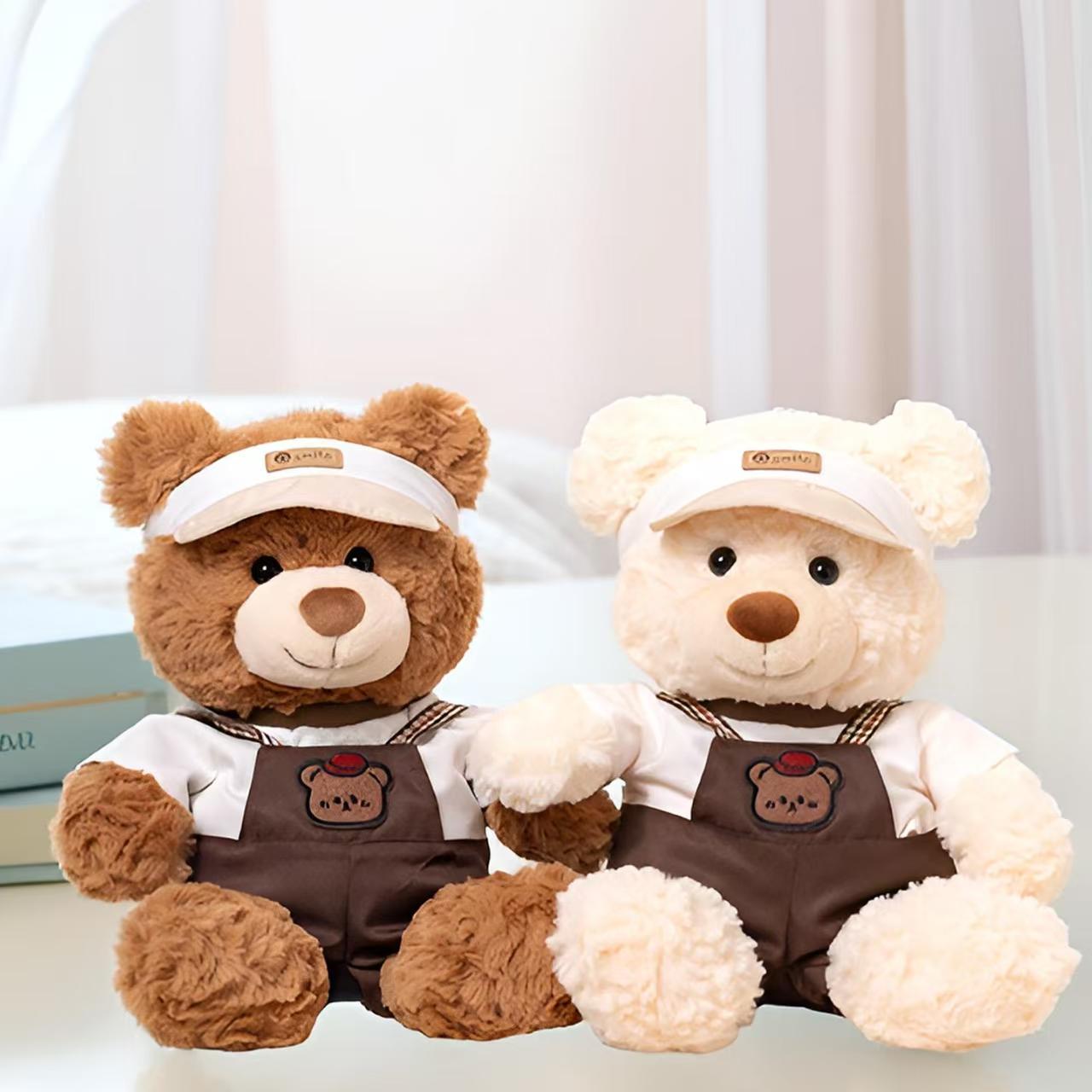 Soft cute teddy bear plush wearing strap-style outfit