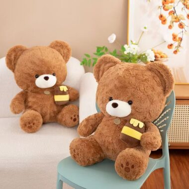 Soft cute teddy bear plush holding a honey pot for gifting