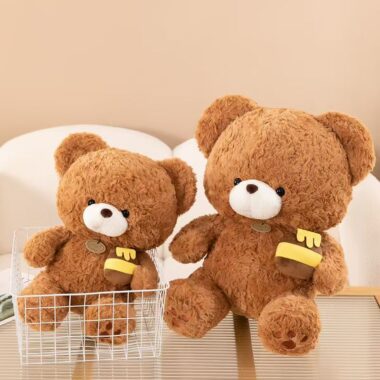 Soft cute teddy bear plush holding a honey pot for gifting