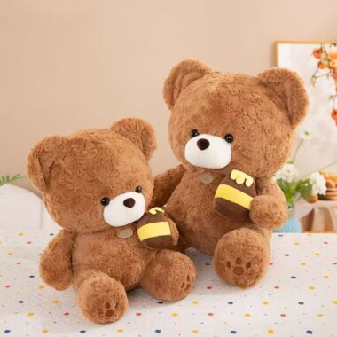 Soft cute teddy bear plush holding a honey pot for gifting