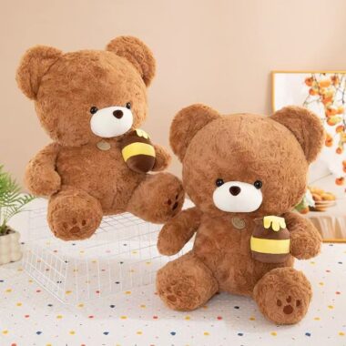 Soft cute teddy bear plush holding a honey pot for gifting