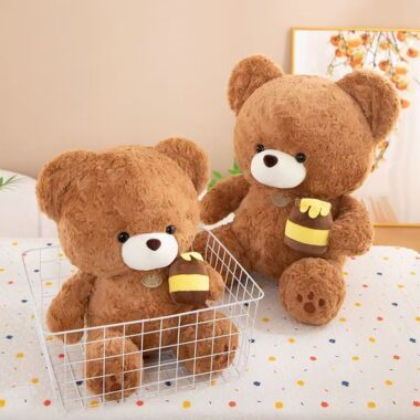 Soft cute teddy bear plush holding a honey pot for gifting