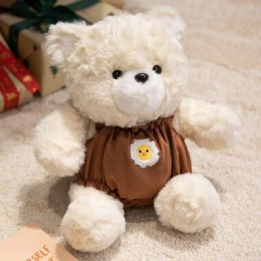 Cute teddy bear plush wearing strap overalls for gifting